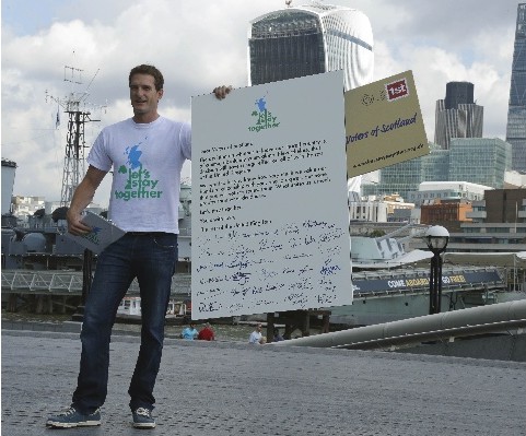 British TV presenter Dan Snow presents a letter to Scottish voters from the Let's Stay Together campaign, asking them to vote against independence in the Scottish independence referendum, in London, Thursday, Aug. 7, 2014. The campaign is supported by celebrities from rock star Mick Jagger to actress Judi Dench, and will tour Britain asking people to add their names to the list of pro-union voices.Matthew Knight/AP